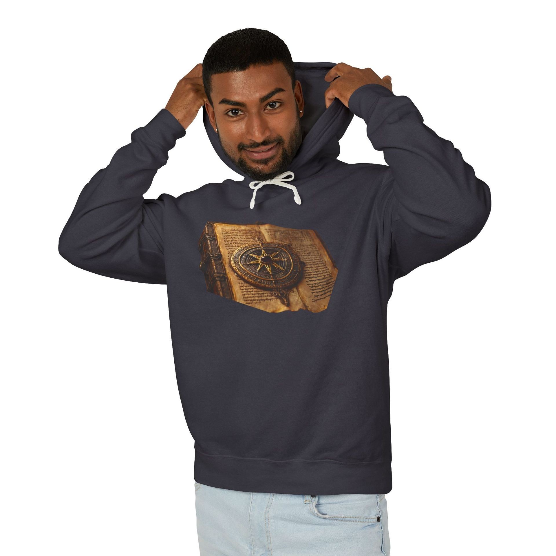 Person wearing a dark hoodie with an image of an old book featuring a compass design.
